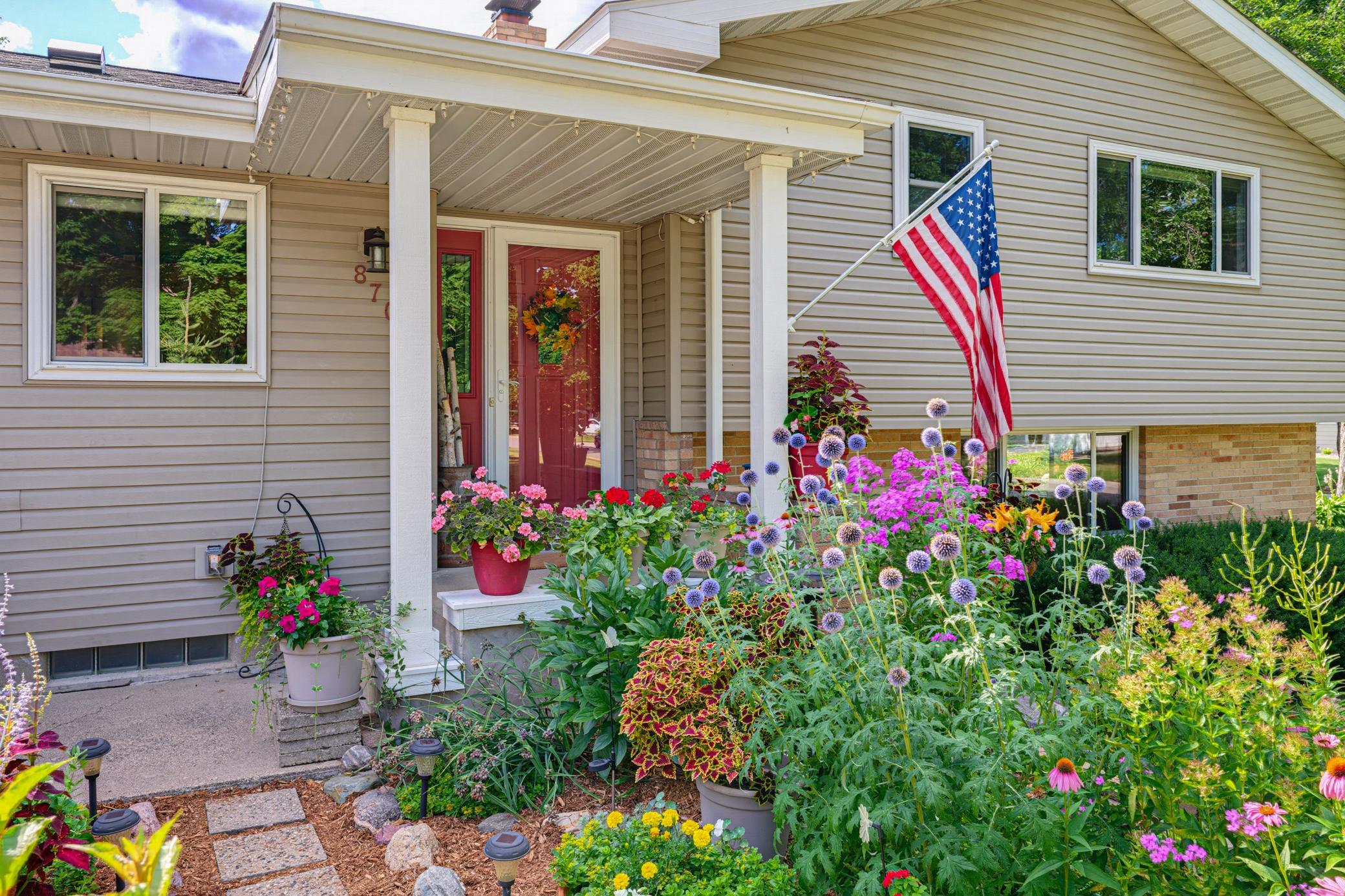 Beautiful landscaping is featured all around this home.