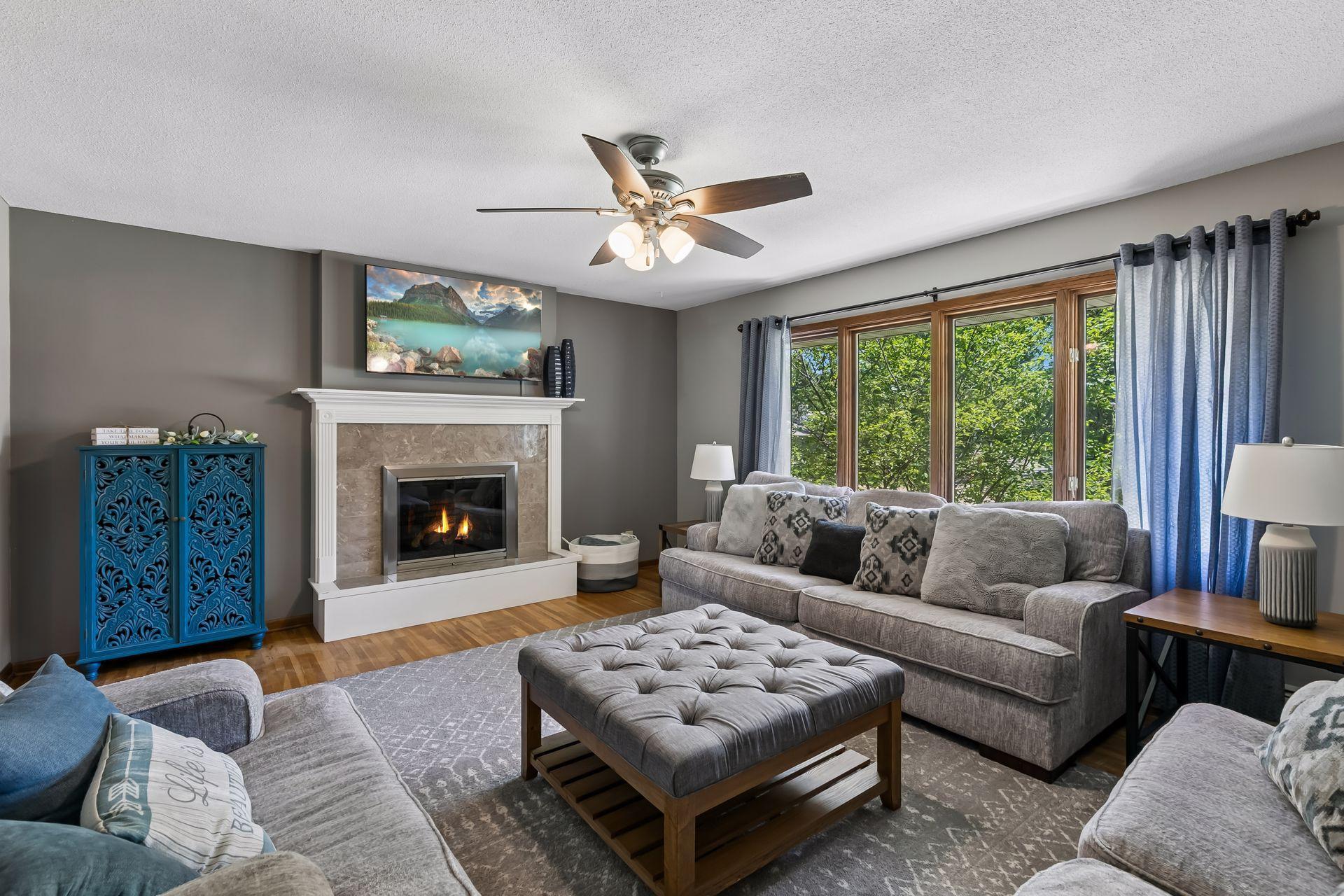 Bright open living room with gas fireplace