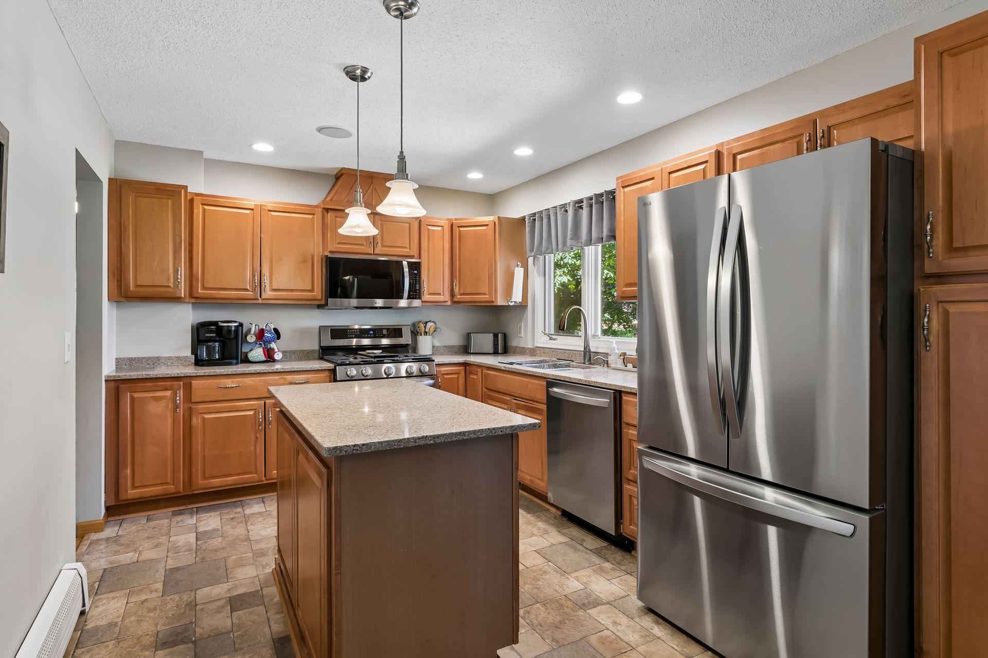 Large kitchen with new stainless steel appliances