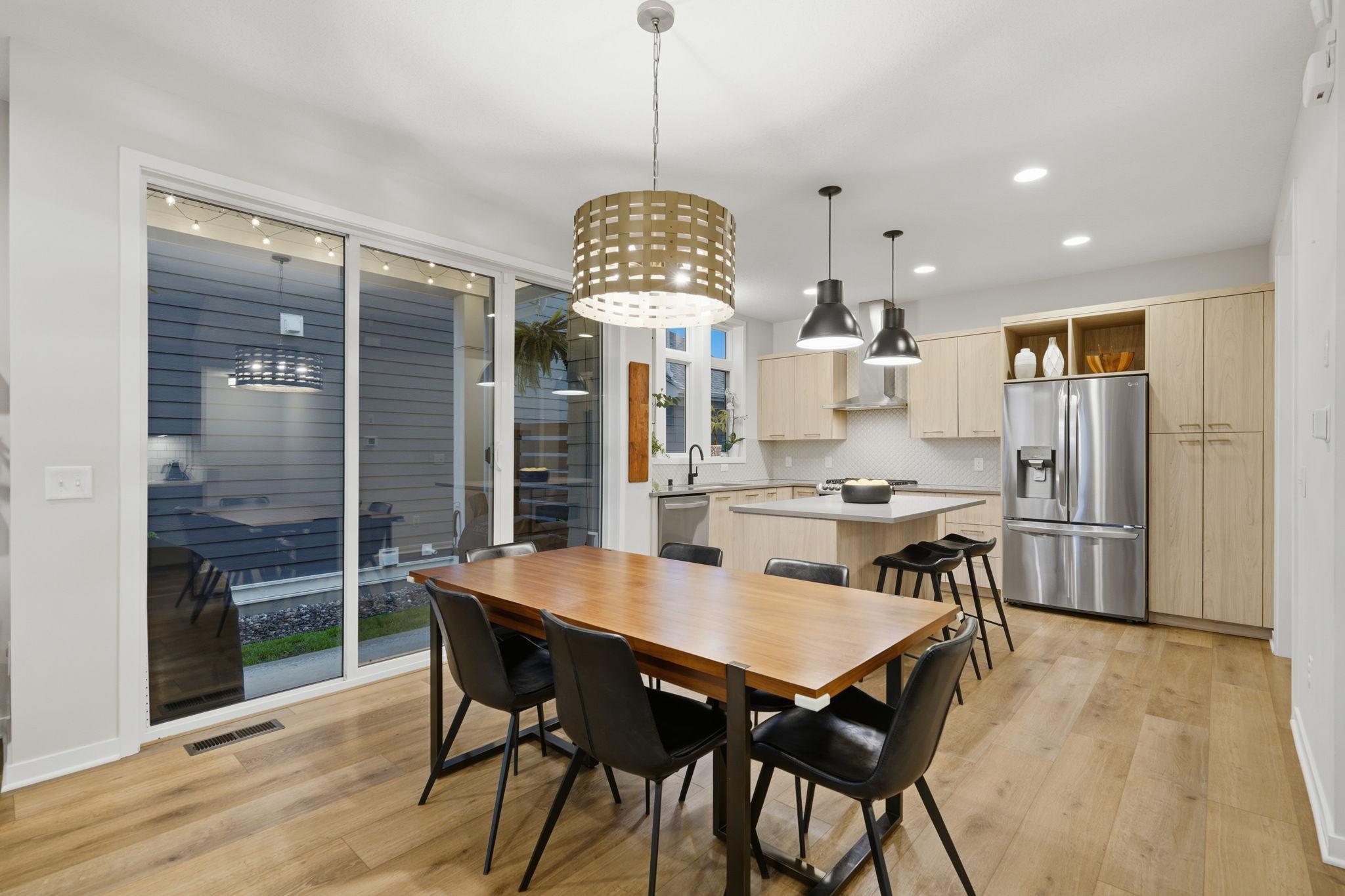Dining room opens to the private covered patio and fenced in maintenance free yard