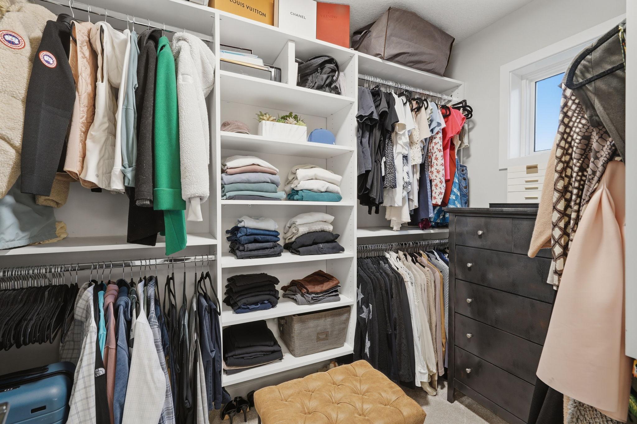 Custom Closet system in the primary bedroom walk in closet