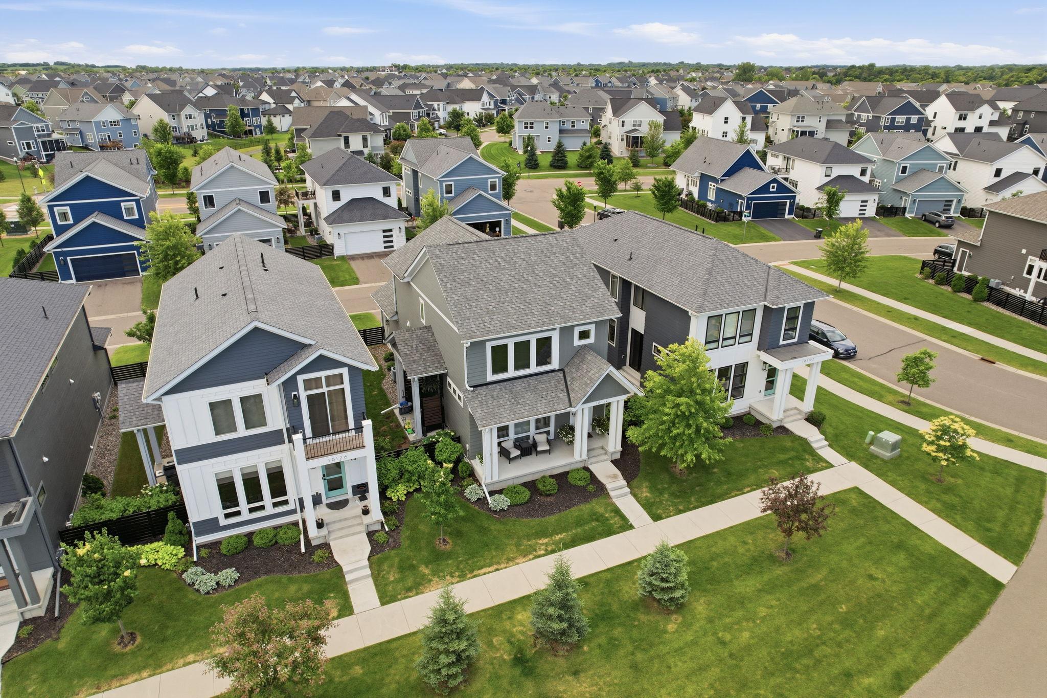 Private front yard with green space and walking paths
