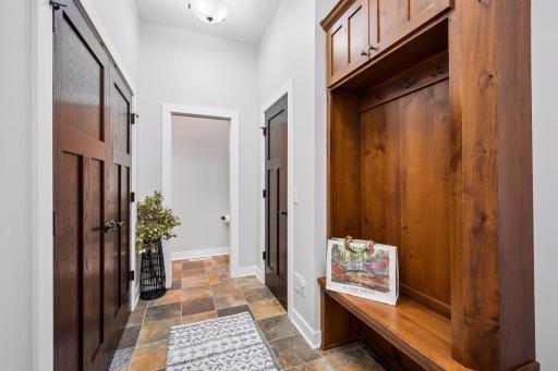 Main floor mudroom with built in boot bench!