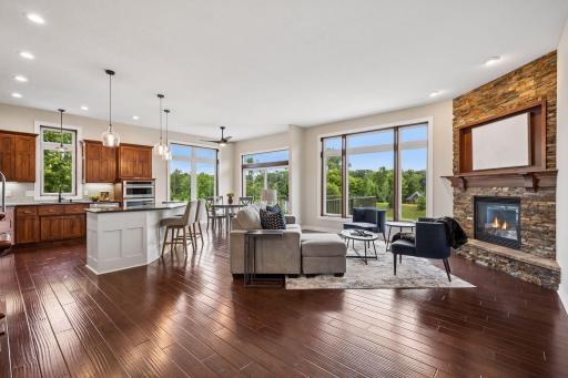 Step inside to the bight and open floor plan! Notice the large floor to ceiling windows!