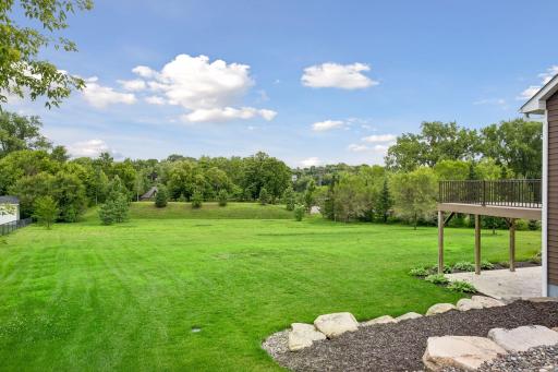 Large flat backyard backing up to the Mississippi River.