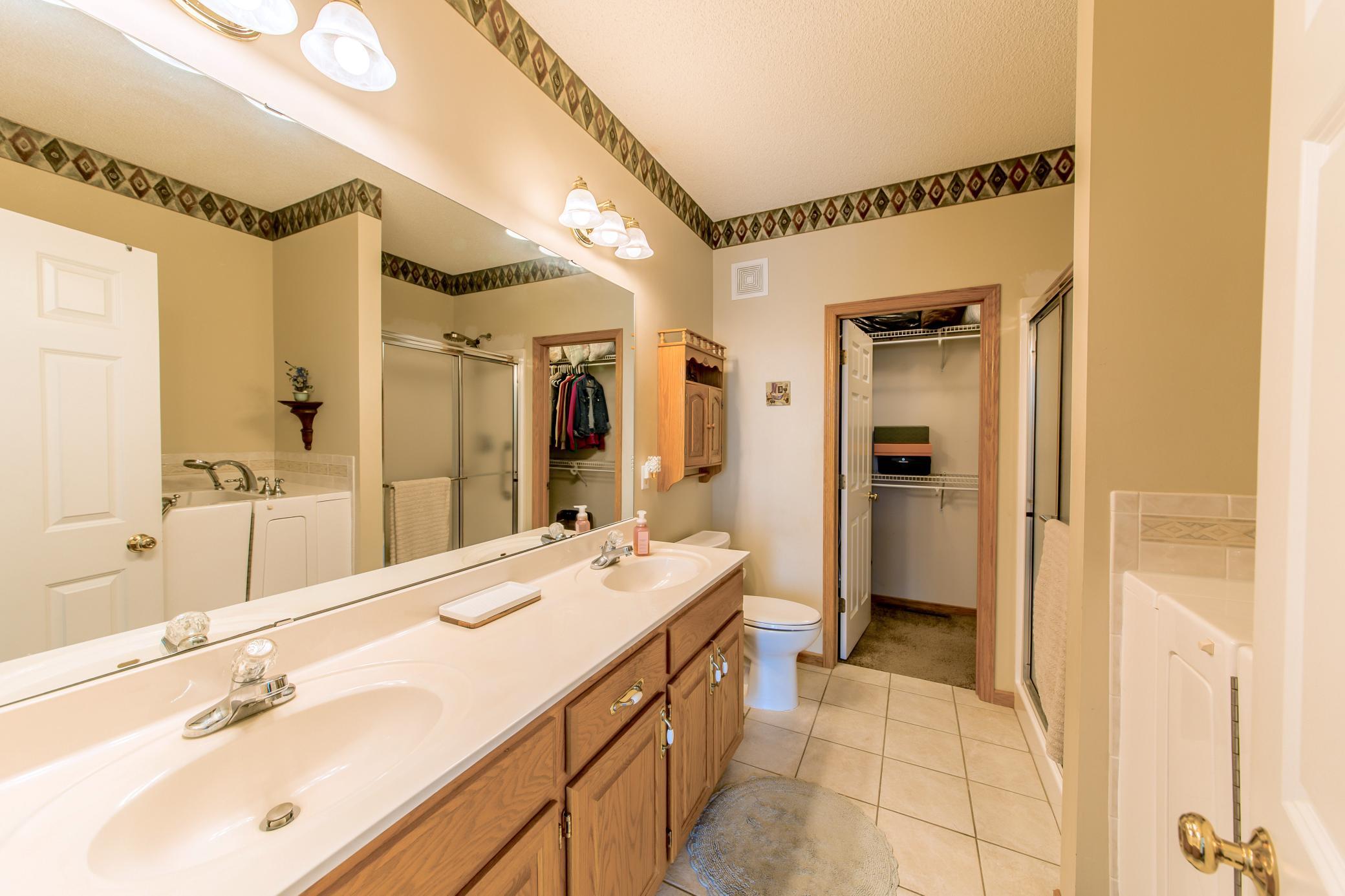 En Suite off of primary bedroom & walk in closet.jpg