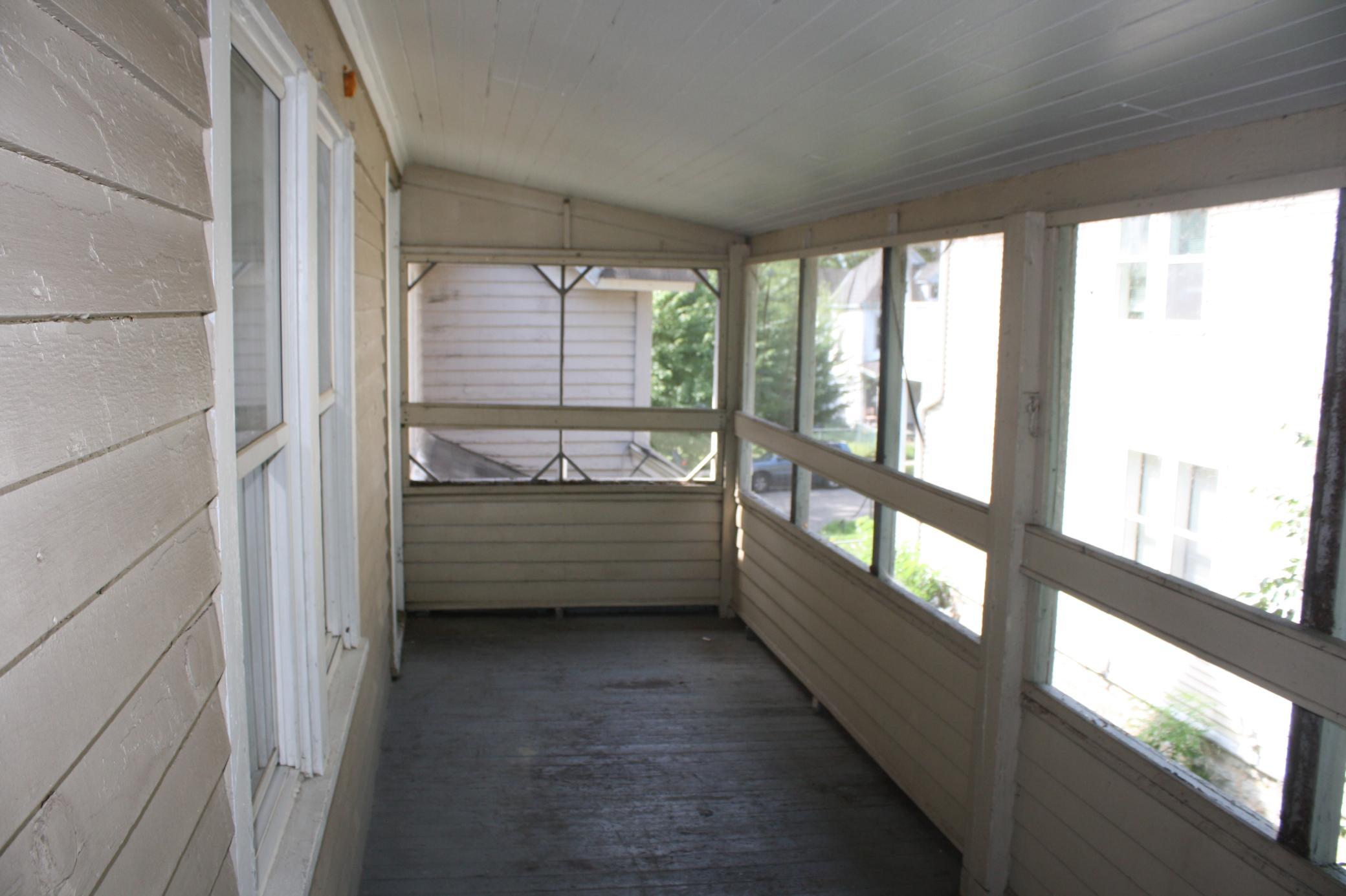 Screened in porch for upper unit