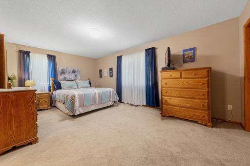 The primary bedroom is spacious and accommodating!