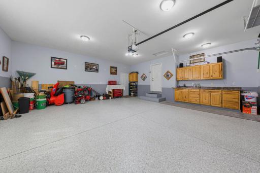 The attached, two-stall, oversized garage is nicely finished and is a comfortable extension to the home. It leads directly into the kitchen upon your arrival home!