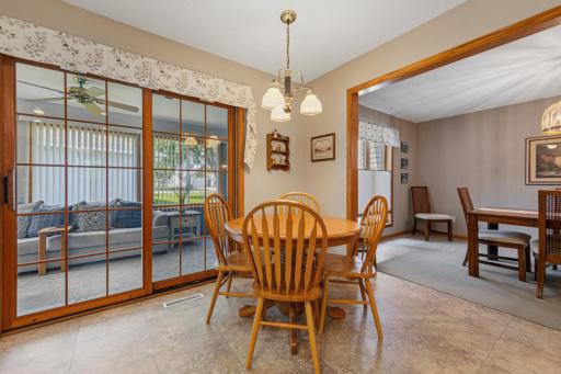 The kitchen accommodates a casual space to enjoy breakfast and coffee, with access to the sunroom or the more formal dining room, just steps away!