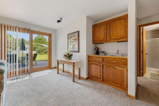 Wet-bar in lower level living room, and the walk-out to back patio and yard.