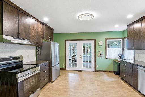 French doors lead to 3 season porch