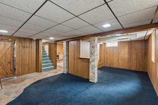 Flexible finished lower-level space with an egress window and room for a closet, offering potential to convert the area into an additional bedroom if desired.
