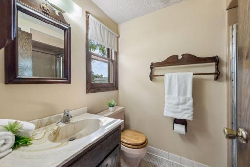 Upper-level bathroom conveniently located near both bedrooms and the den.