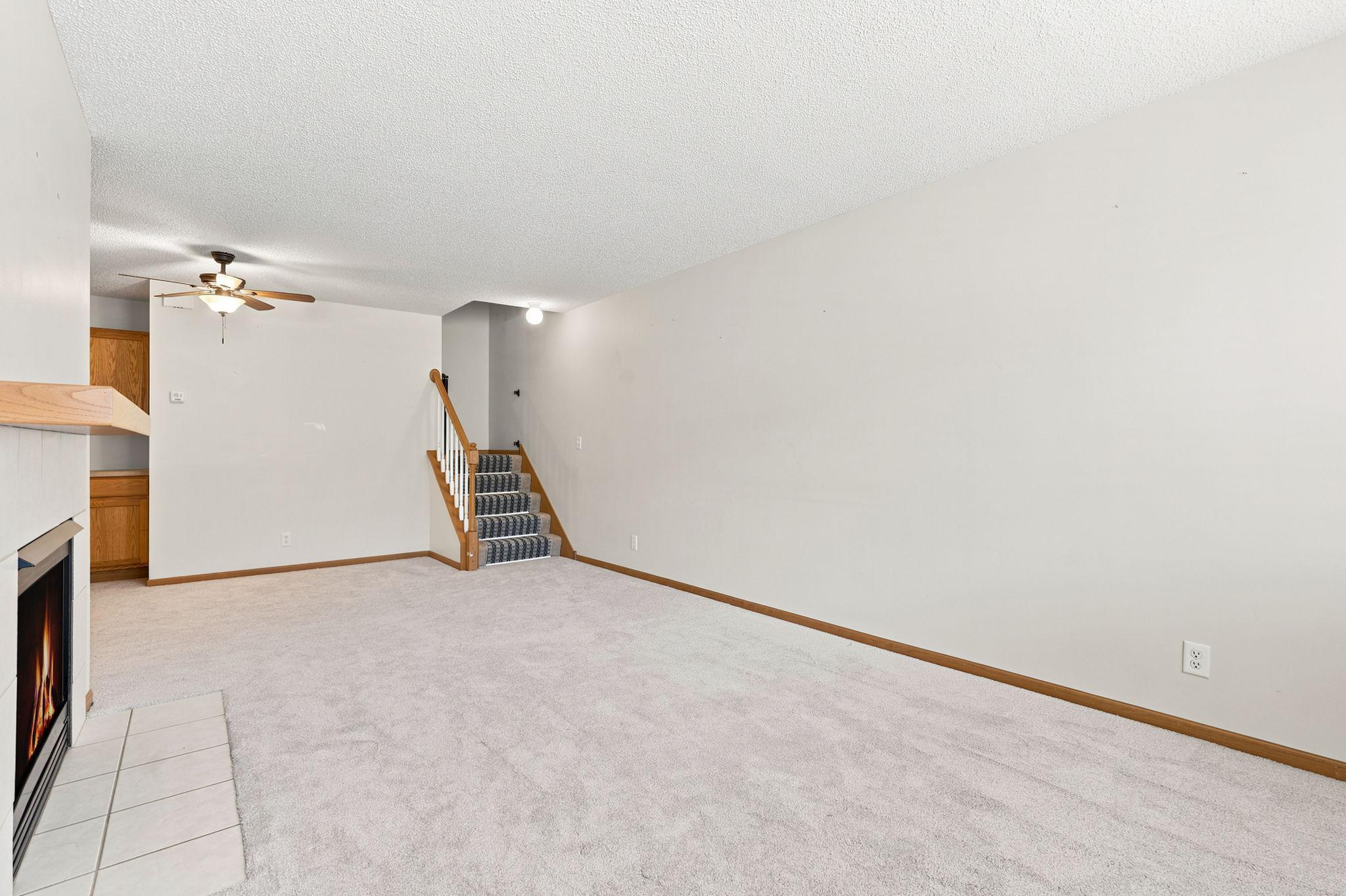 Spacious living area with fresh carpet!