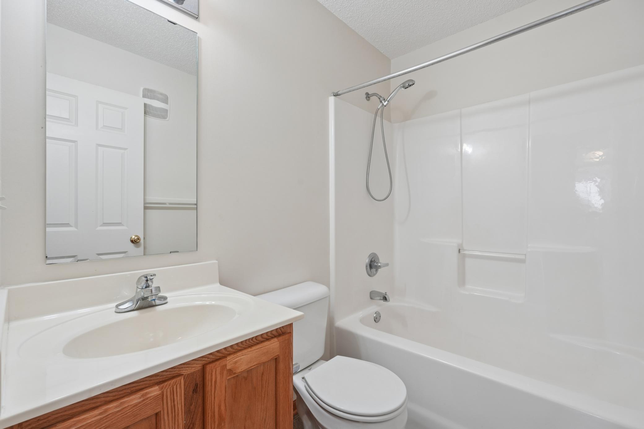 Full bath in hallway.