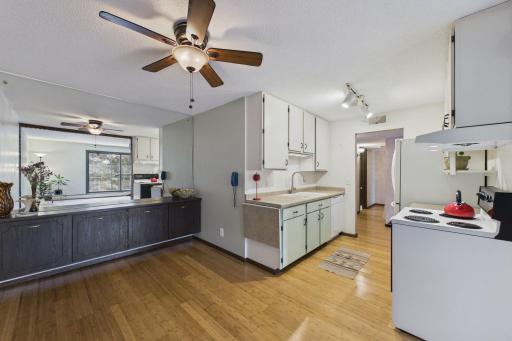 Dining room/Kitchen featuring built-ins and luxurious bamboo flooring