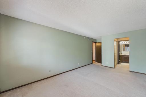 Primary bedroom with walk through closets to bath