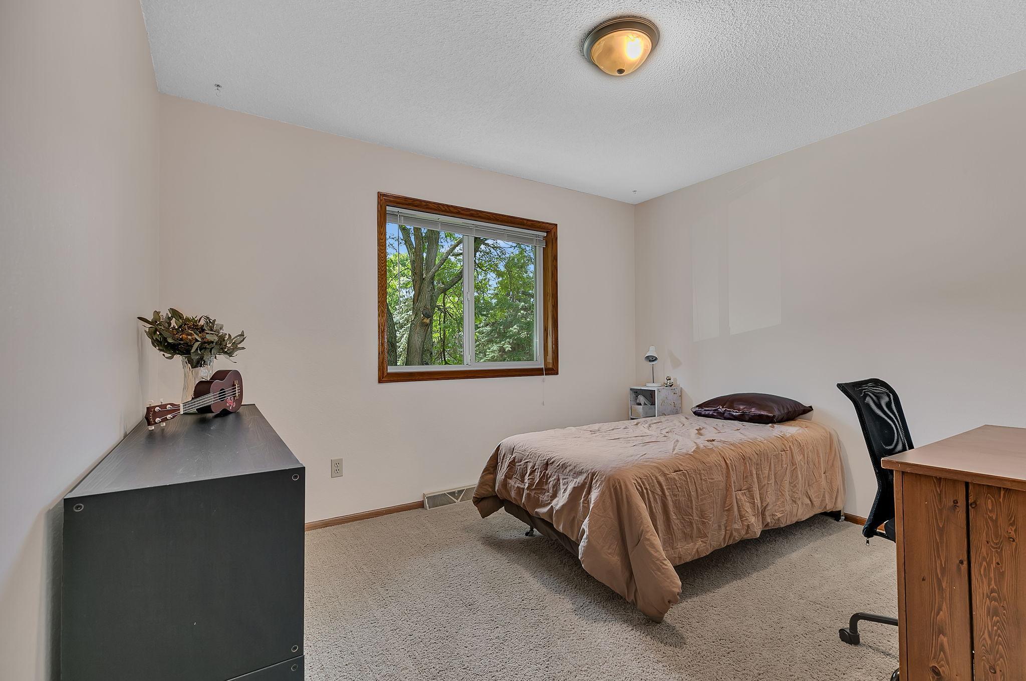 The upper level features two bedrooms, with this being the second of the two.