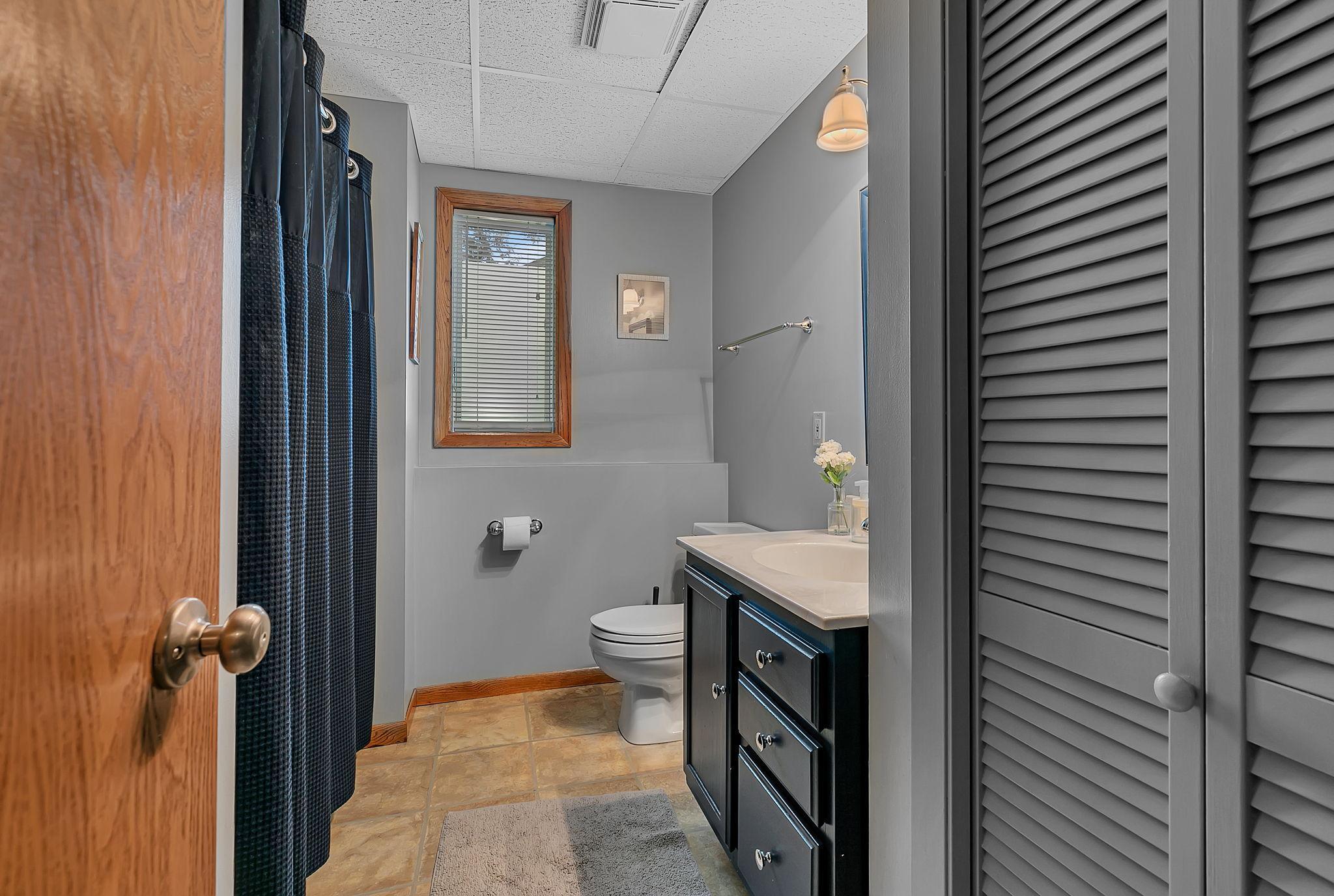 A look at the second full bathroom, conveniently located on the lower level and adding extra comfort and functionality to the home.