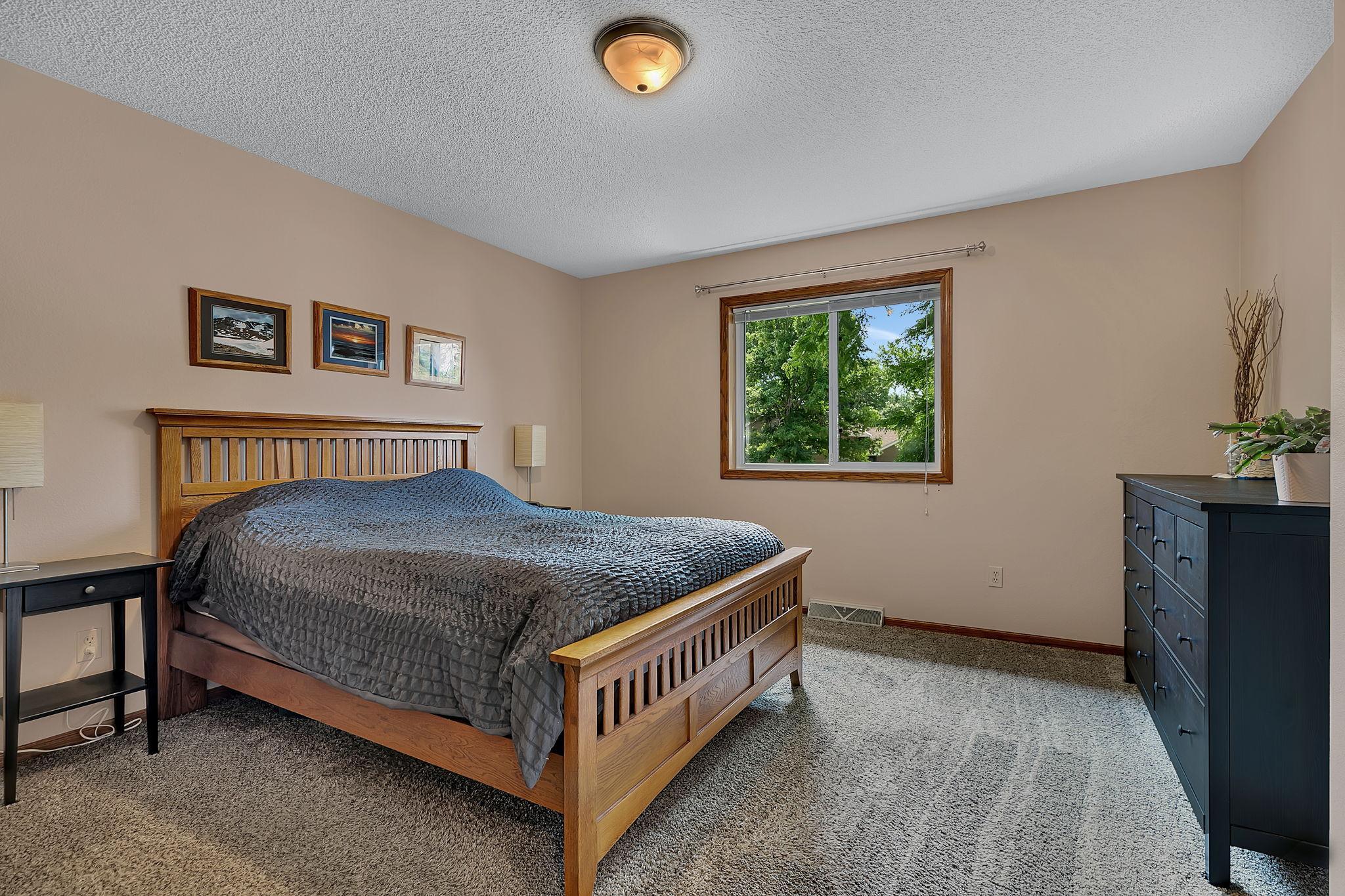 A generously sized primary bedroom offering plenty of space to relax and unwind.