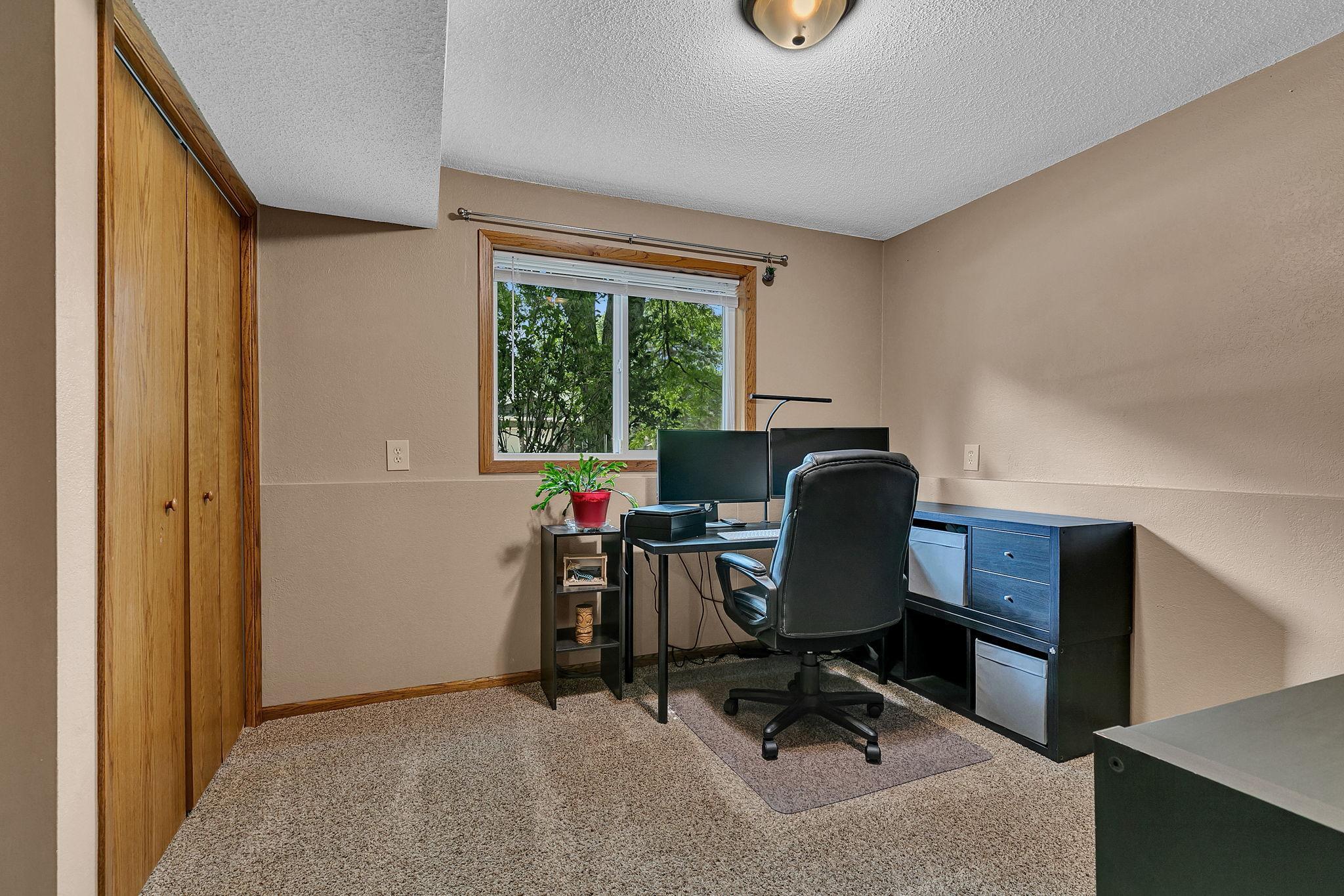 The fourth bedroom is currently set up as a home office, offering a flexible space that can easily adapt to your lifestyle needs.