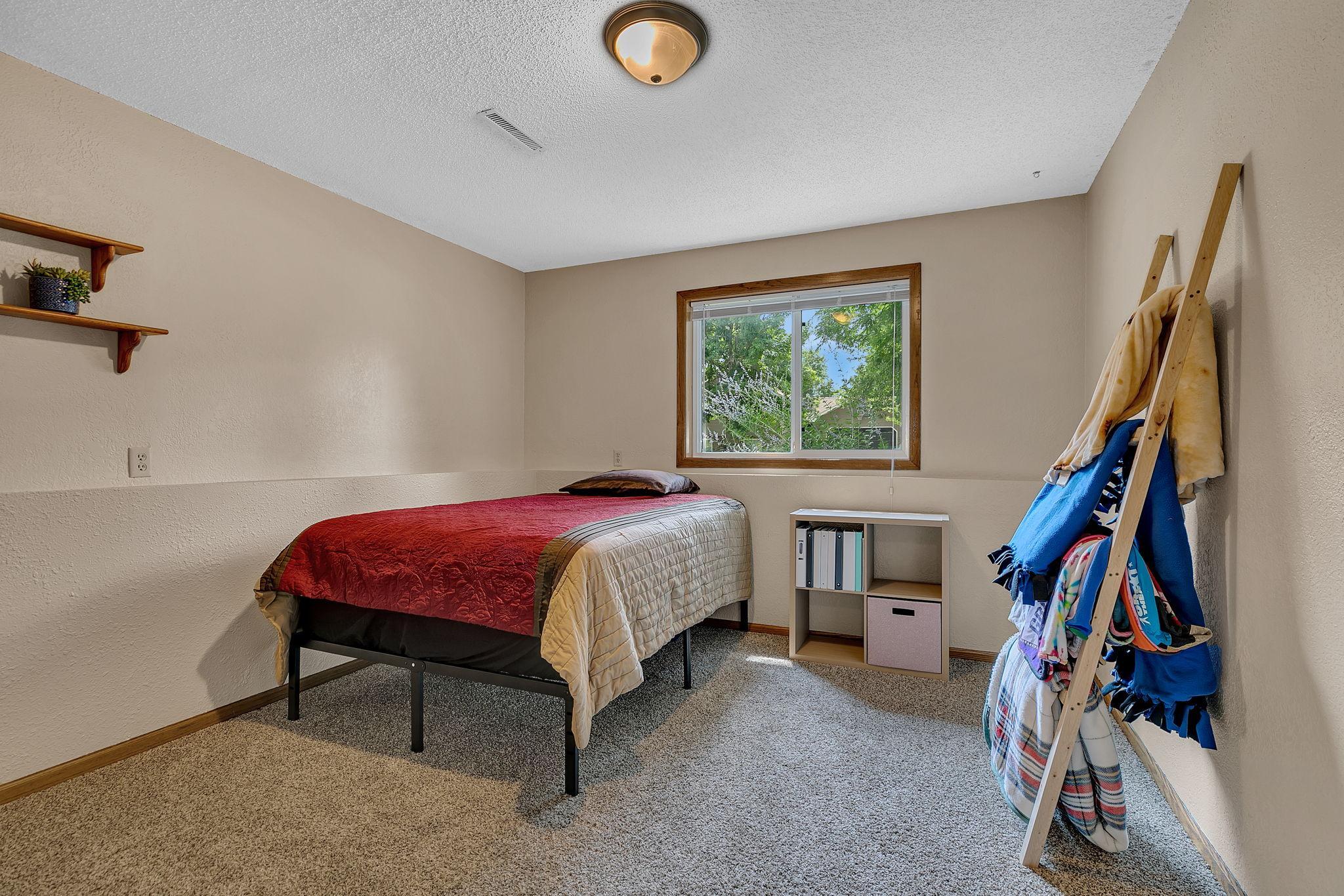 The third of four bedrooms, offering a comfortable space with plenty of flexibility to suit your needs.