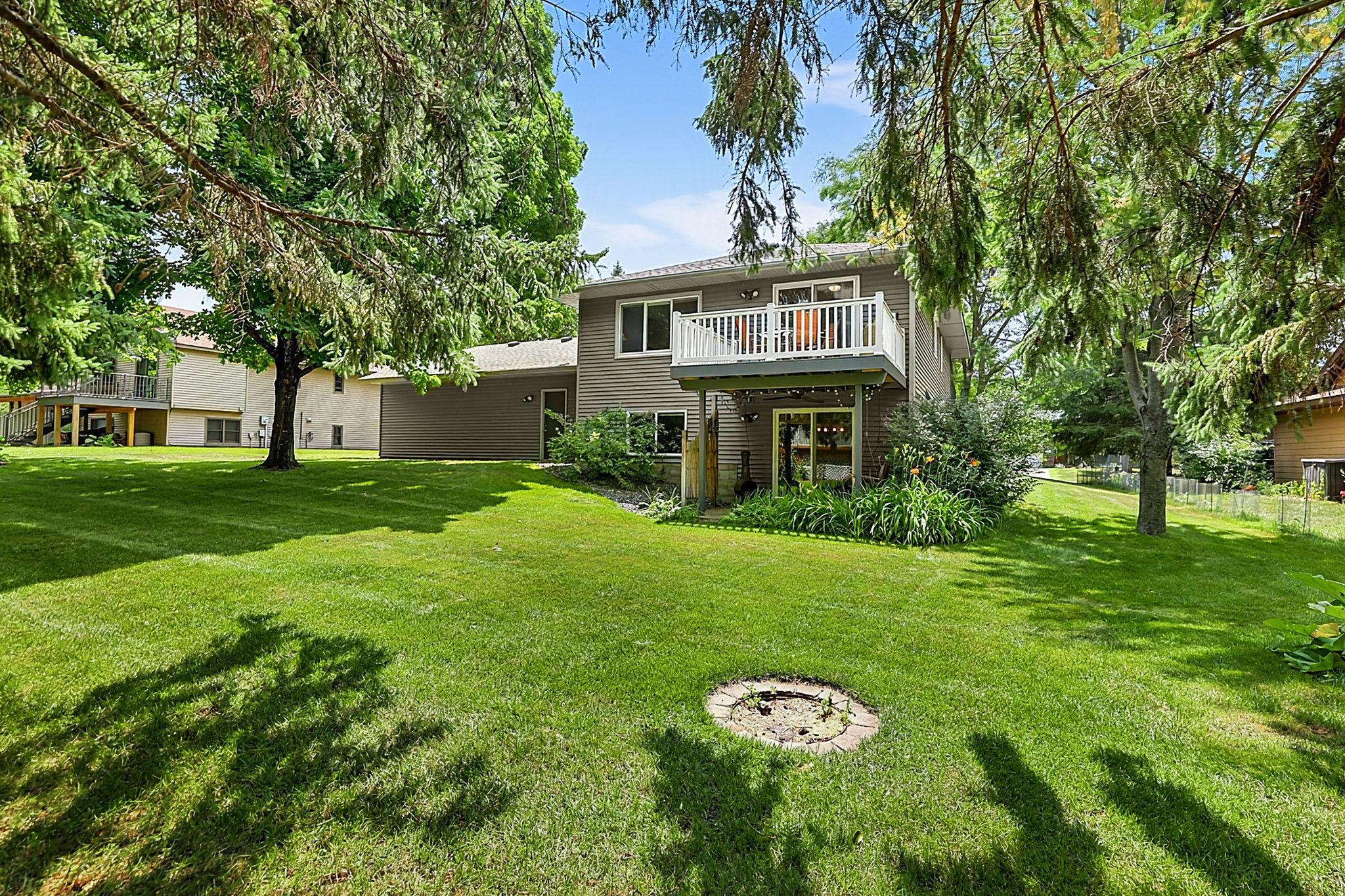 Step outside and enjoy it all—a walkout patio, low-maintenance composite deck, mature trees for added privacy, and an in-ground sprinkler system to keep the yard looking its best with less work.