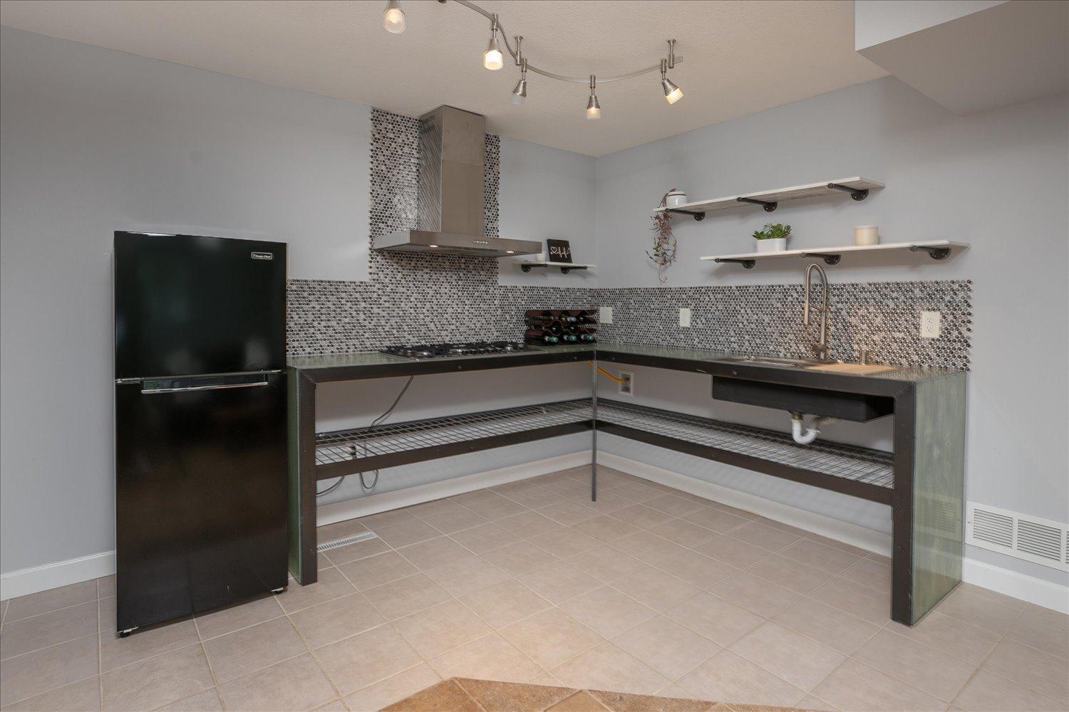 Lower level family room featuring 1/2 kitchen