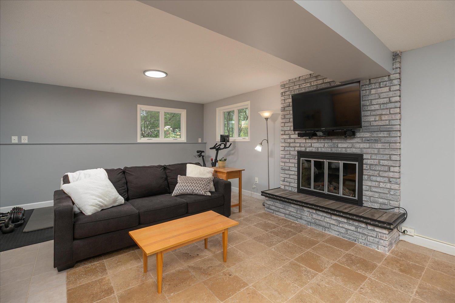Lower level family room featuring fireplace