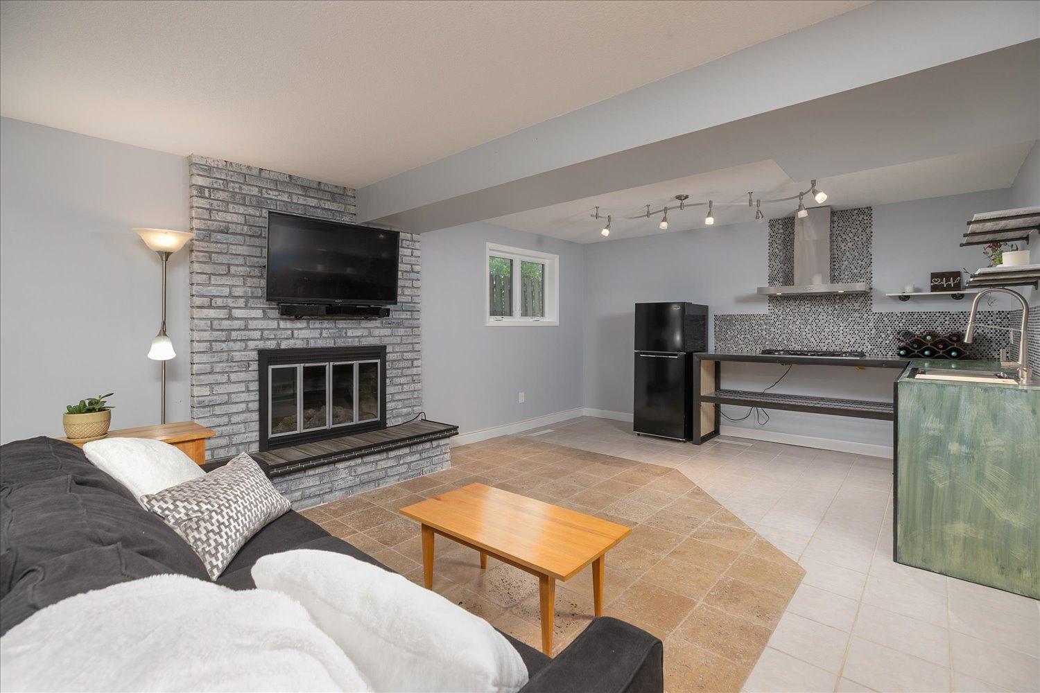 Lower level family room featuring 1/2 kitchen