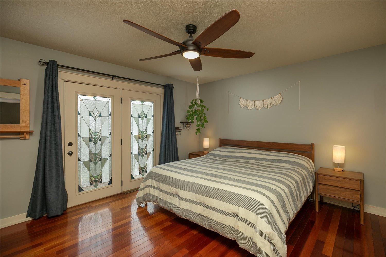 Master bedroom with doors to private deck