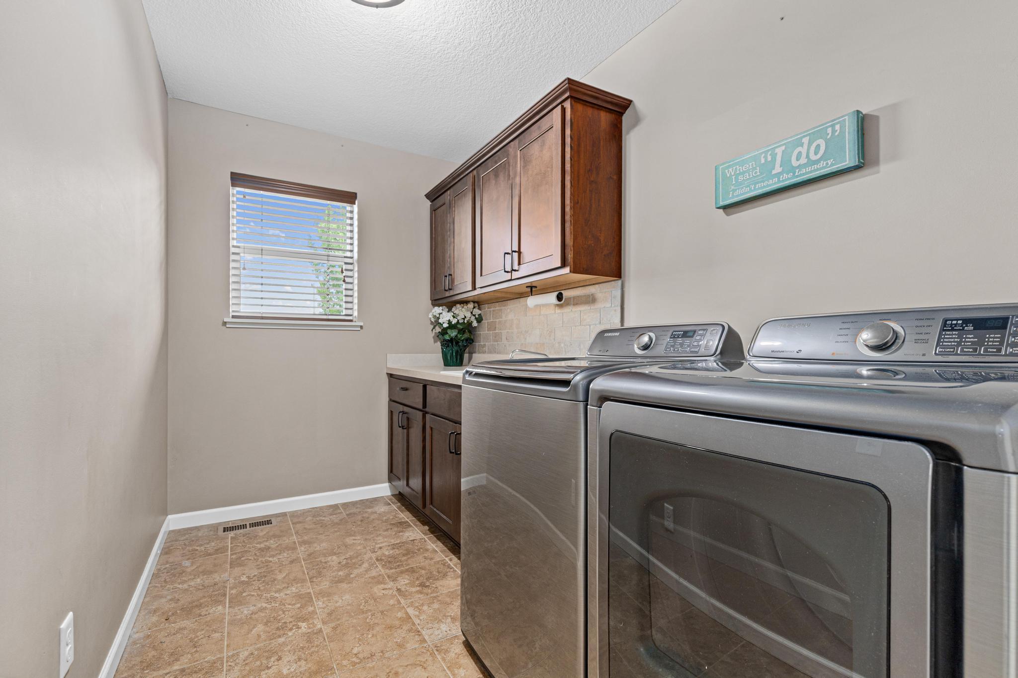 Main floor laundry conveniently located for one level living