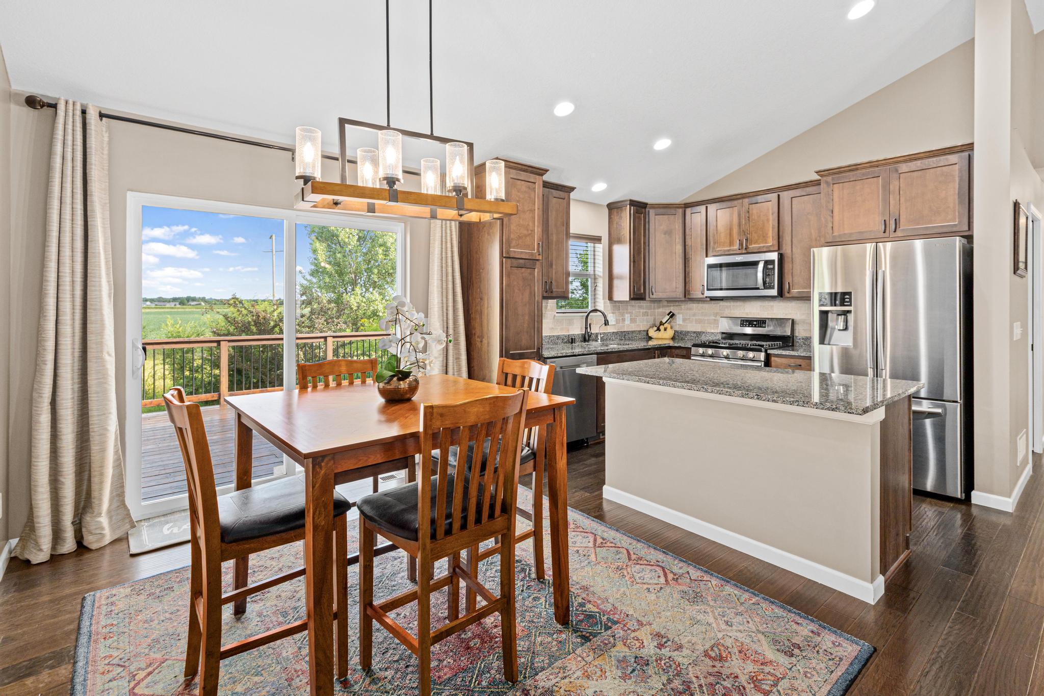 The gorgeous warm toned wood cabinets and granite counters make this the heart of the home.