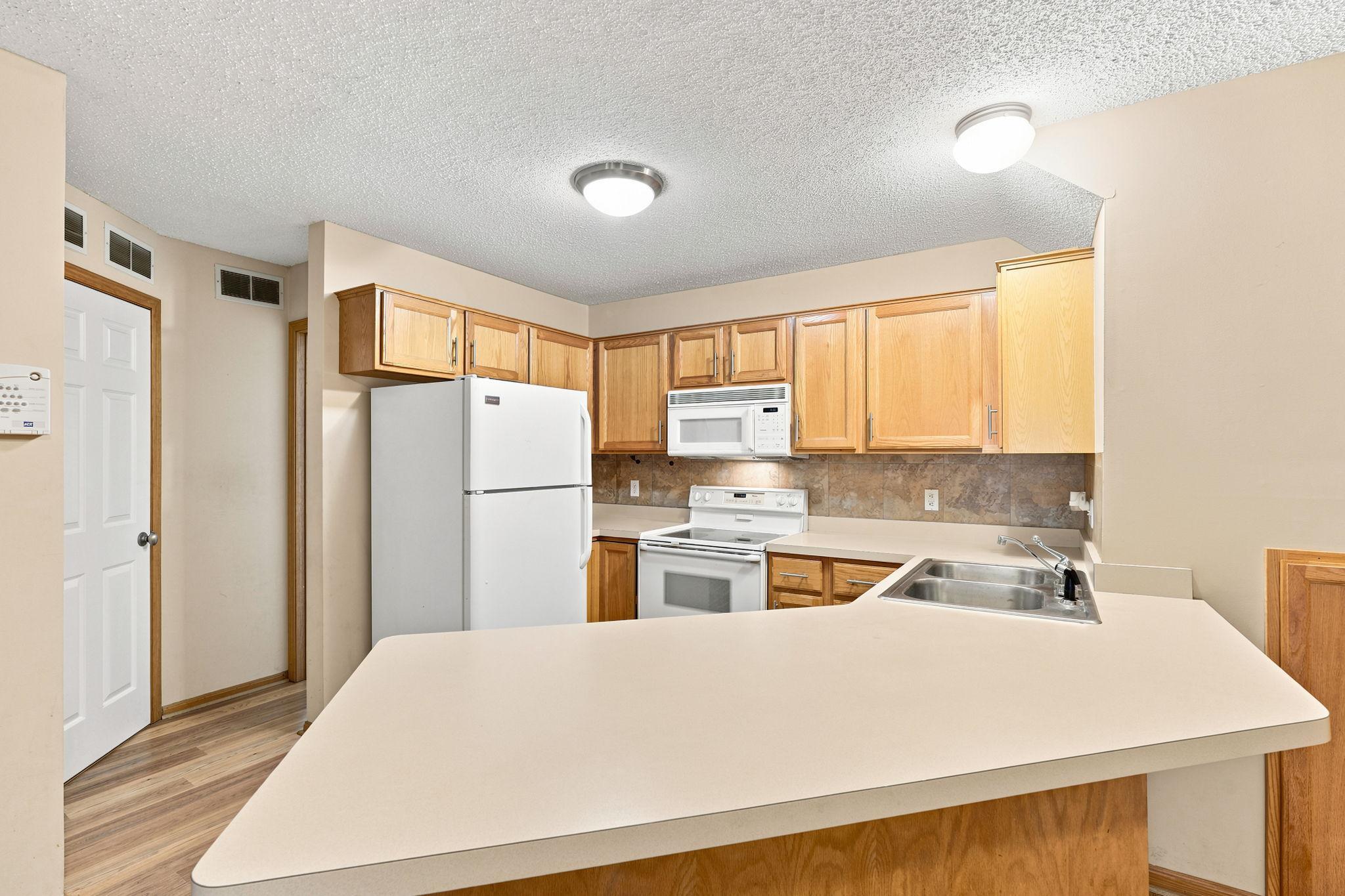 Kitchen with bar stool countertop