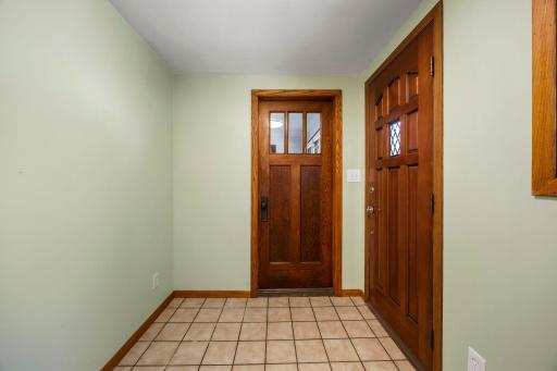 Front entryway with a secondary door to leading to the main level family room .