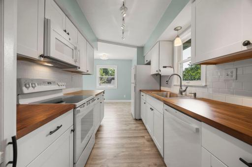 Off the kitchen is a smaller dining area that would make a lovely breakfast nook