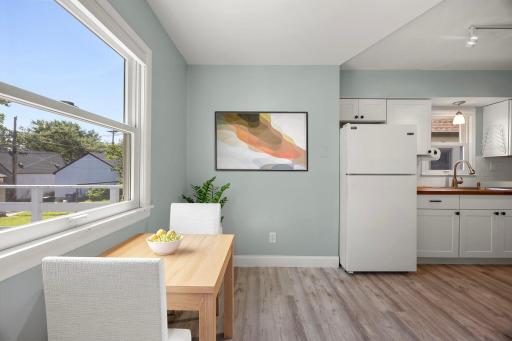 Kitchen and breakfast nook area that has a view of the back deck