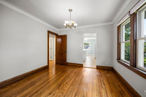 Access from dining area to kitchen and hallway leading to bedrooms and bathroom
