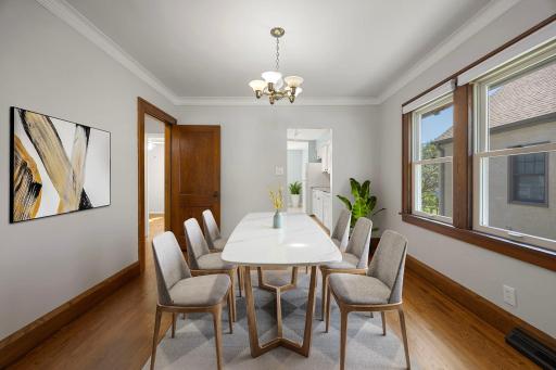 Spacious dining area with wood floors and natural light