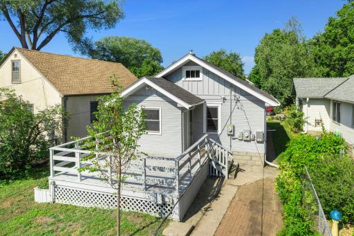 Large deck with a door leading in to the kitchen, easy for outdoor meals and grilling.