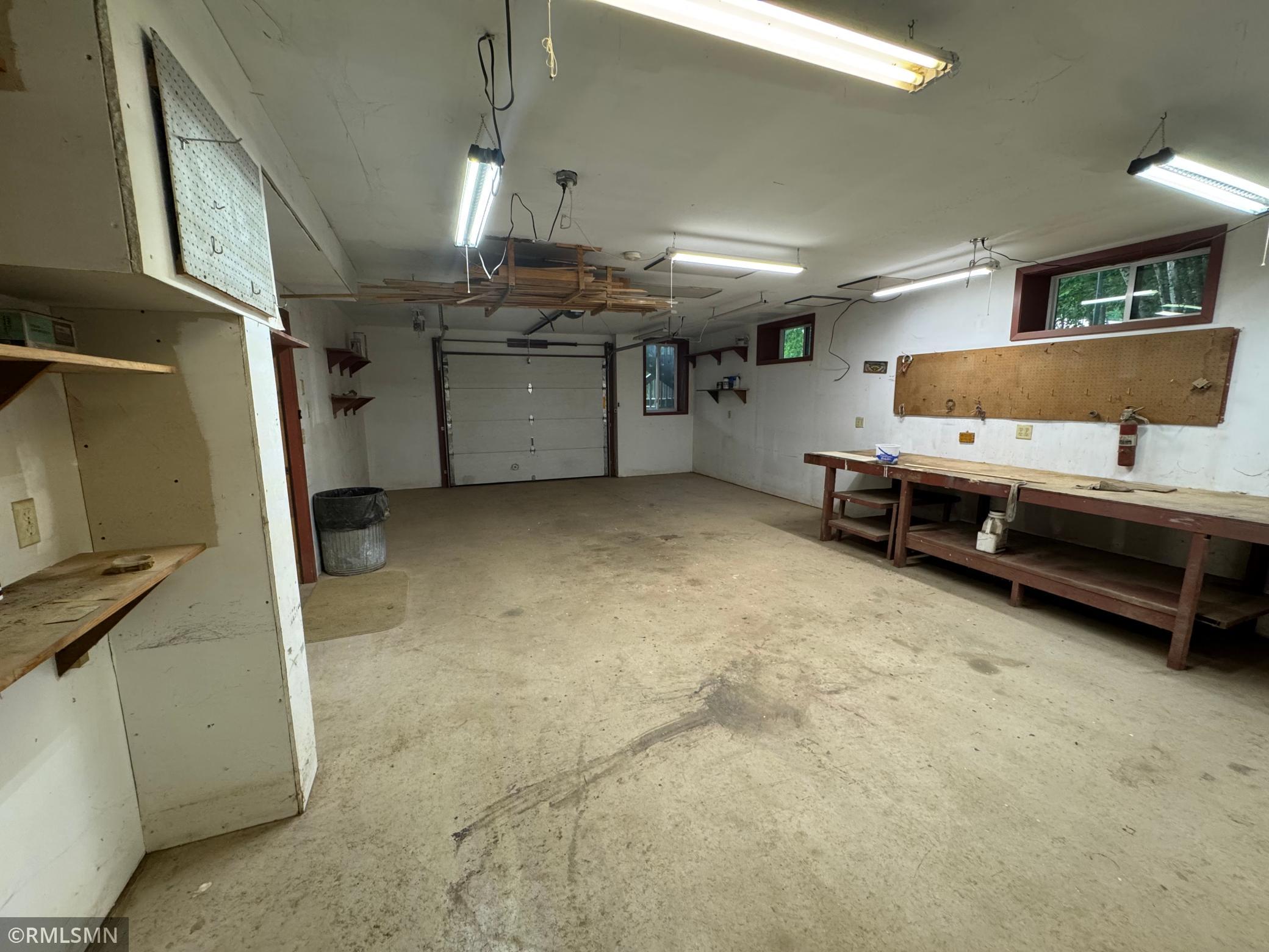 Tunk under garage or could be craft space too.
