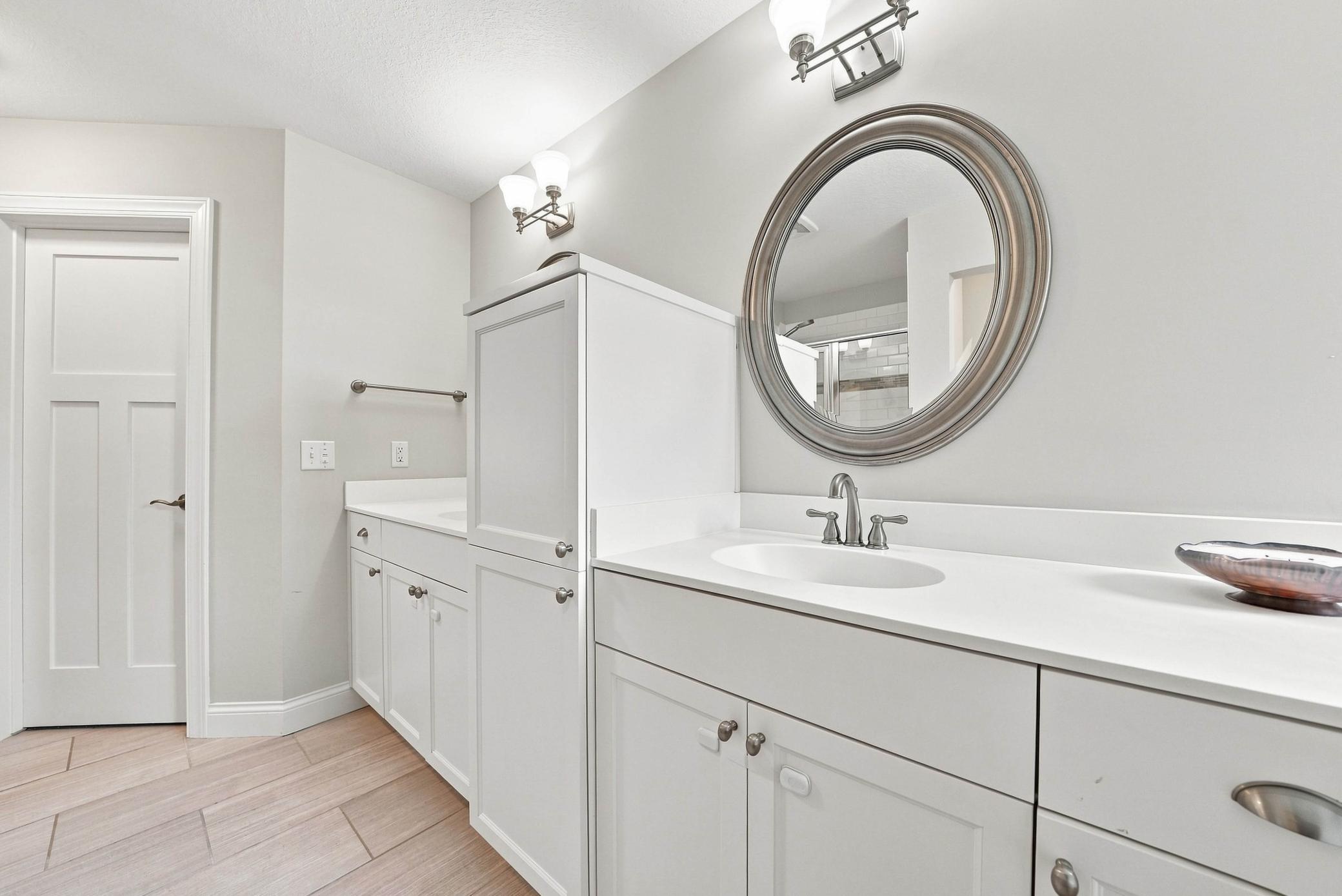 Clean, timeless finishes throughout the primary bath.