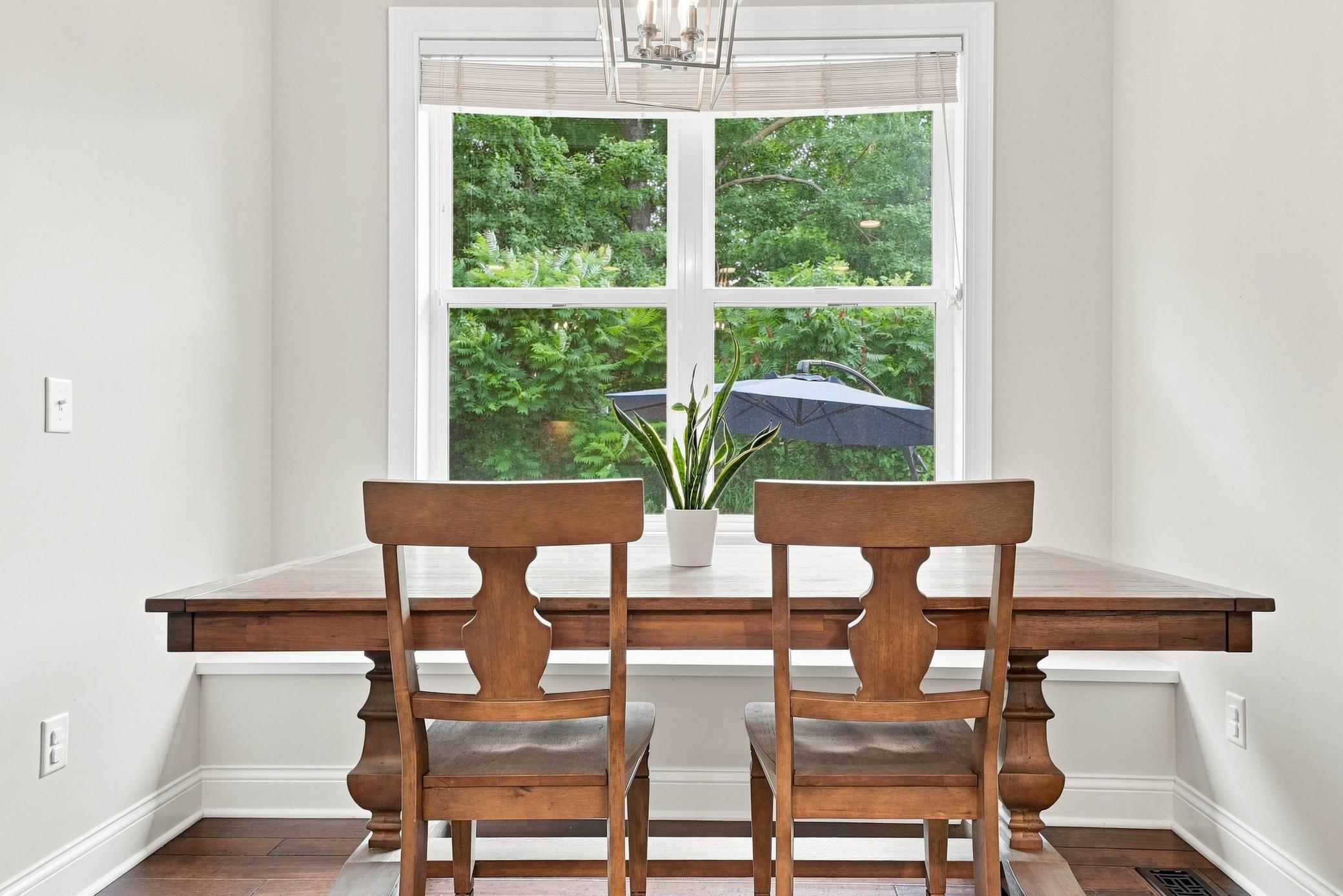 A light-filled breakfast area overlooking the private backyard.
