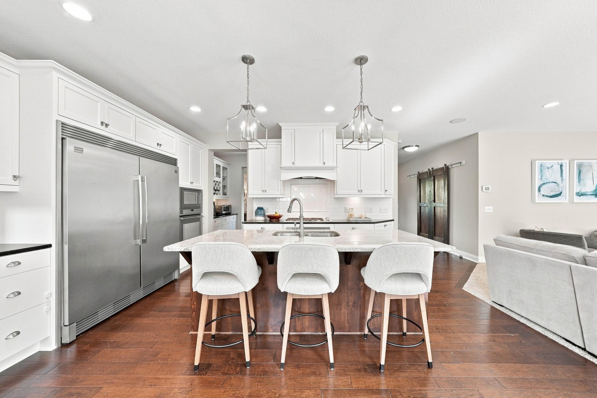 Gourmet kitchen with quartz countertops and farmhouse sink