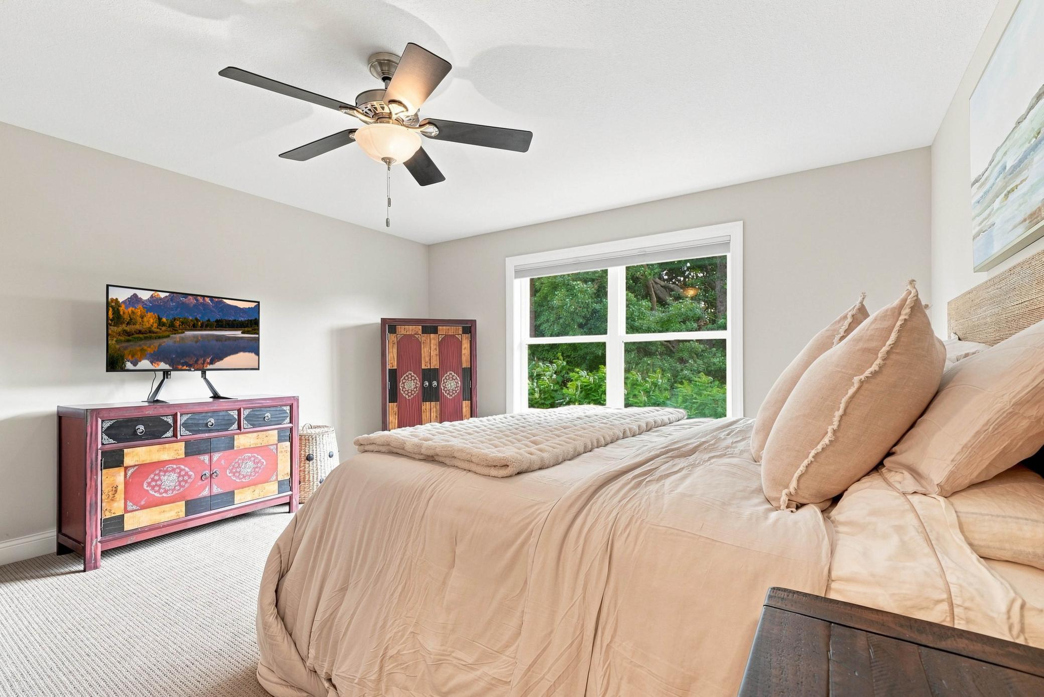 Spacious secondary bedroom with abundant natural light.