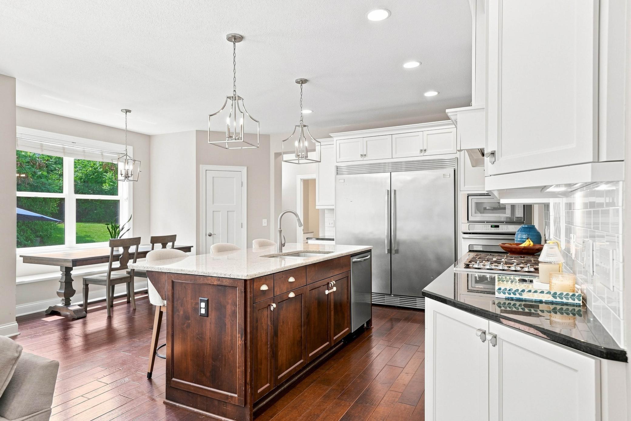Light-filled kitchen with a center island and premium appliances.