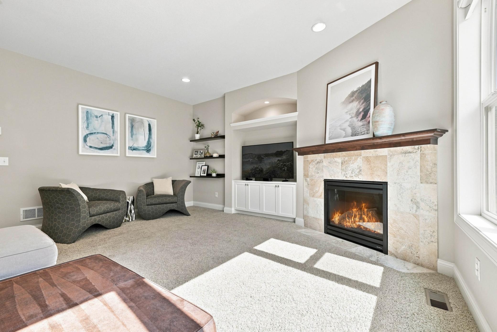 Custom built-ins and a gas fireplace create an inviting focal point.