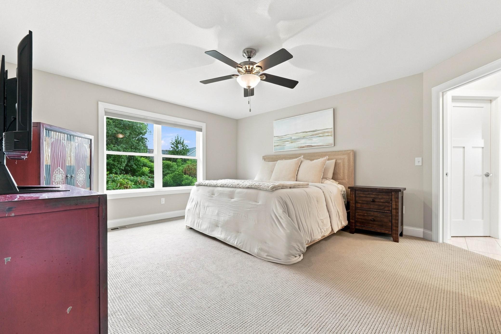 A spacious primary suite designed for comfort and privacy.