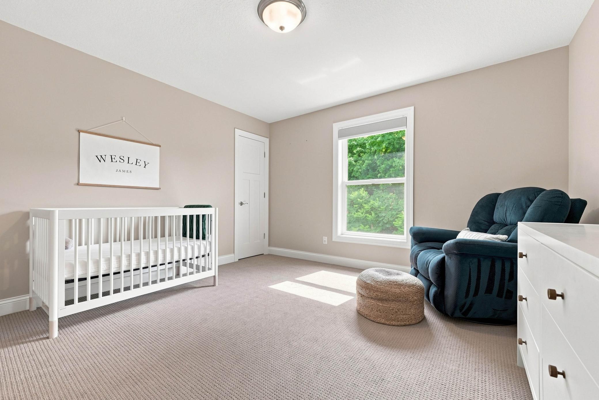 A welcoming guest room or nursery with peaceful views.